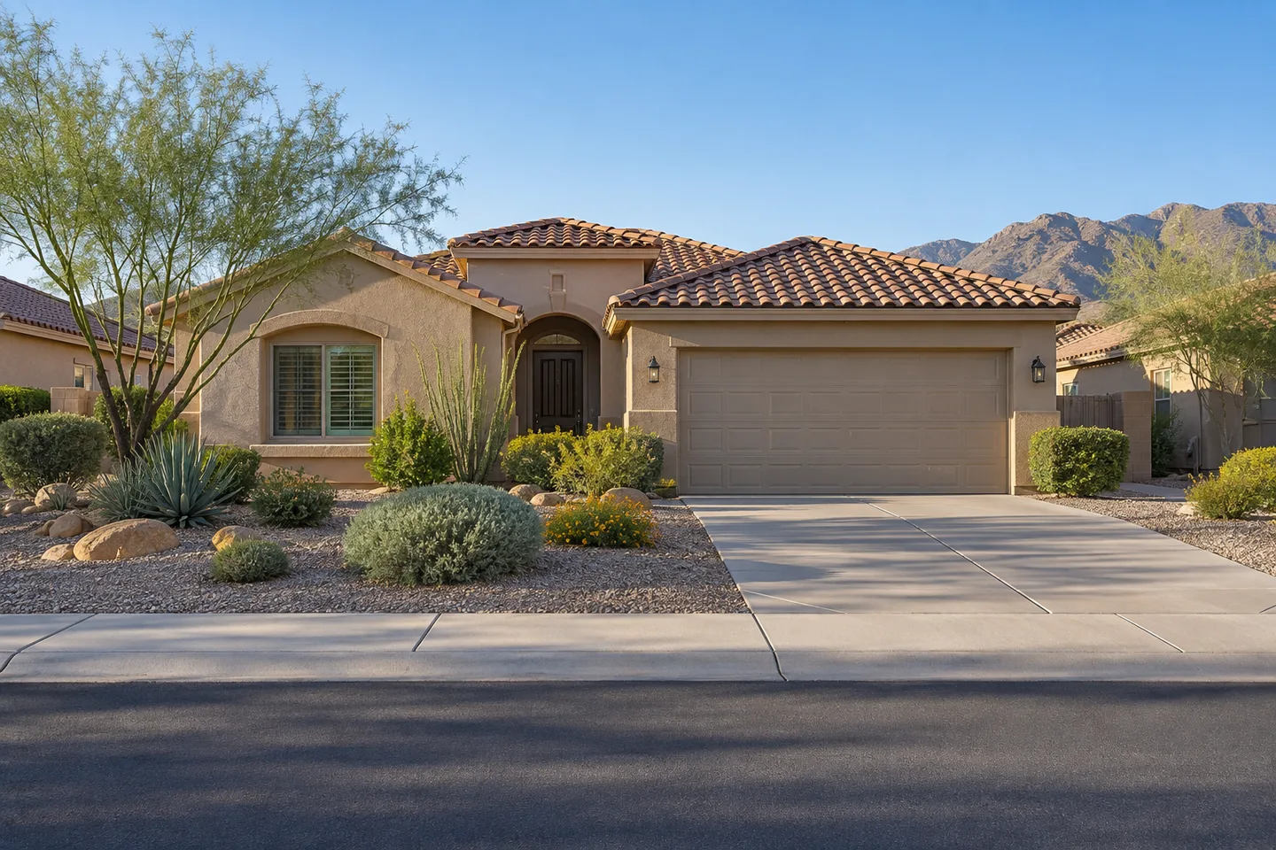 Single-story stucco home with desert landscaping in a Southwest neighborhood.